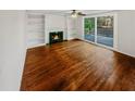Spacious living room featuring hardwood floors and a fireplace at 120 Blackberry Run, Fayetteville, GA 30214