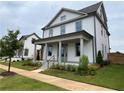 Two-story white house with a front porch and side yard at 1356 Flora Dr, Conyers, GA 30094