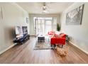 Bright living room with hardwood floors, comfy couch, and access to a balcony at 401 16Th Nw St # 1157, Atlanta, GA 30363