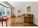 Living room with hardwood floors, bay window and fireplace at 2690 Hideaway Hills Sw Ln, Powder Springs, GA 30127