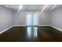 Bright living room featuring hardwood floors and French doors at 2492 Brentwood Ct, Decatur, GA 30032