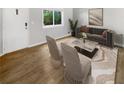 Virtually staged living room with light flooring and modern furniture at 2416 Peachwood Ne Cir # 9, Atlanta, GA 30345