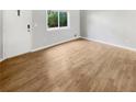 Living room with light gray walls and wood-look flooring at 2416 Peachwood Ne Cir # 9, Atlanta, GA 30345