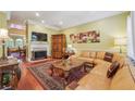 Spacious living room featuring a large sectional sofa and a beautiful fireplace at 542 Centennial Olympic Park Nw Dr # 3, Atlanta, GA 30313