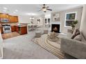 Open concept living room with kitchen, fireplace, and dining area at 4206 Weavers White Ln # 17, Austell, GA 30106