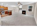 Open concept living room with kitchen, fireplace, and dining area at 4206 Weavers White Ln # 17, Austell, GA 30106