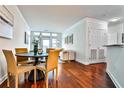 Elegant dining area with hardwood floors and stylish modern chairs at 3334 Peachtree Ne Rd # 704, Atlanta, GA 30326