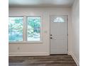 Bright entryway with new flooring and white door at 1916 Penelope Nw Rd, Atlanta, GA 30314