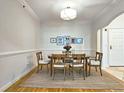 Formal dining room featuring hardwood floors and an oval table at 1735 Peachtree Ne St # 210, Atlanta, GA 30309