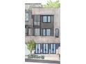 Stylish townhome exterior with wood accents, sleek windows, and a small tree at 11554 Serenbe Ln, Chattahoochee Hills, GA 30268