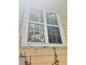 Damaged window with broken glass and weathered frame at 2159 Martin Luther King, Jr. Dr, Atlanta, GA 30310