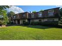 Townhome building showcasing a well-maintained exterior and green space at 3010 Parc Lorraine, Lithonia, GA 30038