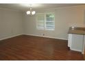 Bright dining room features hardwood floors and a chandelier at 1142 Hembree Ln, Austell, GA 30168