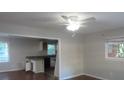 Open living room with hardwood floors and a view of the kitchen at 1142 Hembree Ln, Austell, GA 30168