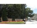 Community entrance with landscaping and signage at 3777 Peachtree Ne Rd # 1021, Atlanta, GA 30319