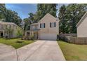 Two-story brick home with a front porch and yard at 2248 Annes Lake Cir, Lithonia, GA 30058