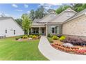 Welcoming front porch and beautifully landscaped yard at 105 Summerlin Dr, Canton, GA 30115