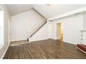 Living room with staircase and laminate flooring at 4245 Brandy Ann Dr, Acworth, GA 30101
