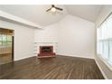 Living room with fireplace and dark brown laminate flooring at 4245 Brandy Ann Dr, Acworth, GA 30101