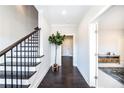 Bright hallway with dark hardwood floors and a staircase at 1434 Fairmont Ave, Atlanta, GA 30318