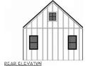 Rear elevation of a farmhouse featuring two windows and a dormer window at 24 Cheney St, East Point, GA 30344