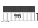 Left side elevation of a farmhouse-style home with a dark metal roof at 24 Cheney St, East Point, GA 30344