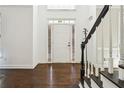 Bright entryway with hardwood floors and staircase at 714 Beacon Cv, Lawrenceville, GA 30043