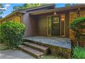 Inviting front porch with stone steps and brick accents at 4872 Northland Dr, Atlanta, GA 30342
