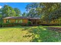 Brick ranch home with a well-maintained lawn at 4872 Northland Dr, Atlanta, GA 30342