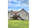 House back with deck, stairs, and yard at 6561 Harrington Pl, Douglasville, GA 30135