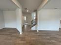 Open living area with hardwood floors and views to the foyer and staircase at 263 Arwen Drive Lot 65, Mcdonough, GA 30252