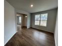 Bright dining room with hardwood floors and a view of the front yard at 263 Arwen Drive Lot 65, Mcdonough, GA 30252