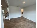 Bright dining room with wood-look floors and access to kitchen at 263 Arwen Drive Lot 65, Mcdonough, GA 30252