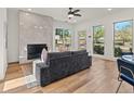 Living room with fireplace, hardwood floors, and large windows at 1940 Fellowship Rd, Tucker, GA 30084