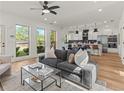 Open concept living and kitchen area with hardwood floors at 1940 Fellowship Rd, Tucker, GA 30084