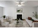 Virtually staged living room with fireplace at 2110 Glenwood Downs Dr, Decatur, GA 30035