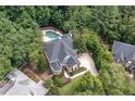 Home with a pool in a wooded neighborhood at 4567 Brigade Ne Ct, Roswell, GA 30075