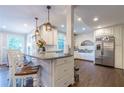 Spacious kitchen with granite countertops and stainless steel appliances at 303 Walnutwood Trl, Roswell, GA 30075