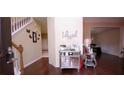 Bright entryway with hardwood floors and mirrored cabinet at 5179 Meadowbrooke Chase, Stone Mountain, GA 30088