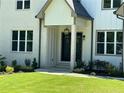 Modern front entrance with black metal door and gray brick accents at 270 Crosstree Ln, Atlanta, GA 30328