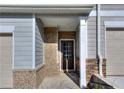Townhome entry with brick and siding exterior at 6120 Ripple Way # 46, South Fulton, GA 30349