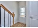 Foyer with staircase and door to garage at 6116 Ripple Way # 47, South Fulton, GA 30349