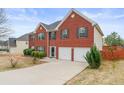 Two story brick home with two car garage and manicured lawn at 3756 Bondurant Dr, Douglasville, GA 30135