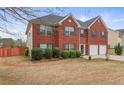 Two story brick home with two car garage and manicured lawn at 3756 Bondurant Dr, Douglasville, GA 30135