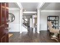 Bright entryway with hardwood floors, leading to staircase and living areas at 1069 Georgian Point Dr, Lawrenceville, GA 30045