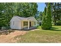 Charming white brick ranch house with a covered porch and large backyard at 1886 S Gordon Sw St, Atlanta, GA 30310