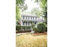 Two story house with a large front yard and porch at 1080 Chestnut Hill Sw Cir, Marietta, GA 30064