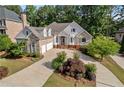 Beautiful home on a tree-lined street with a large driveway at 6159 Fernstone Nw Ct, Acworth, GA 30101