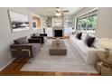 Bright living room featuring hardwood floors, fireplace, and built-in shelving at 278 Doeskin Se Trl, Smyrna, GA 30082