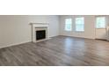Living room with fireplace and gray vinyl flooring at 3139 Redwood Run, Atlanta, GA 30349
